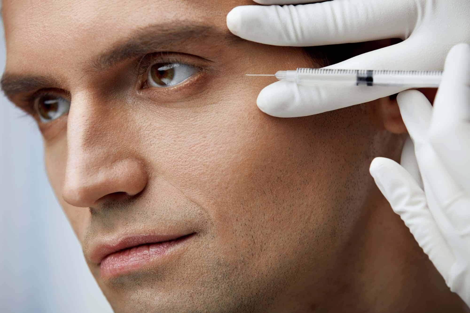 man getting a facial treatment