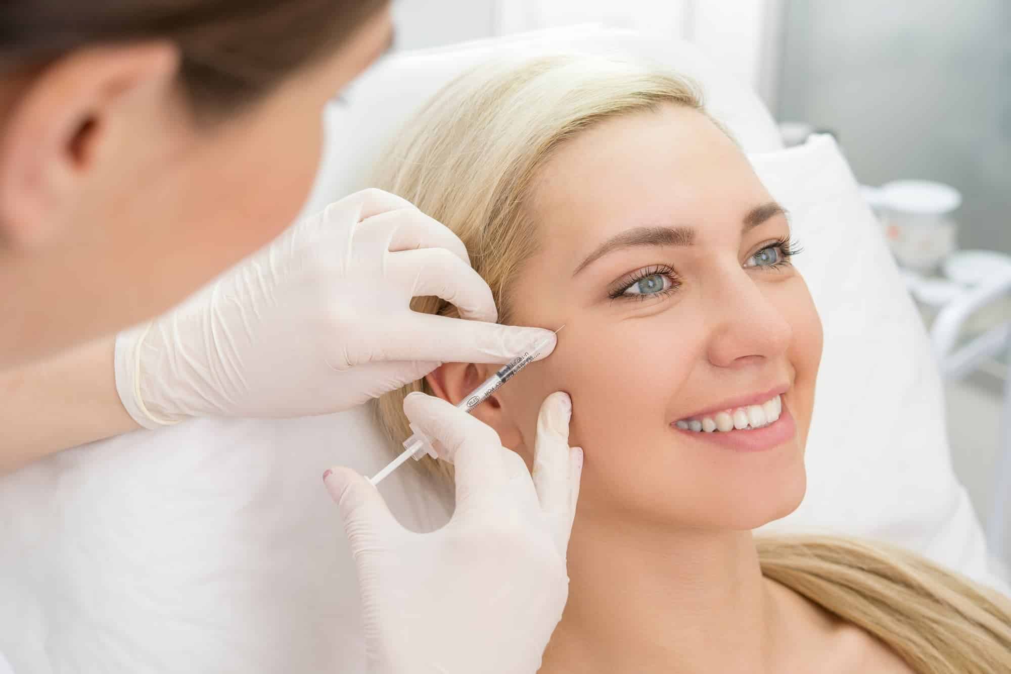 woman getting a facial filler injection