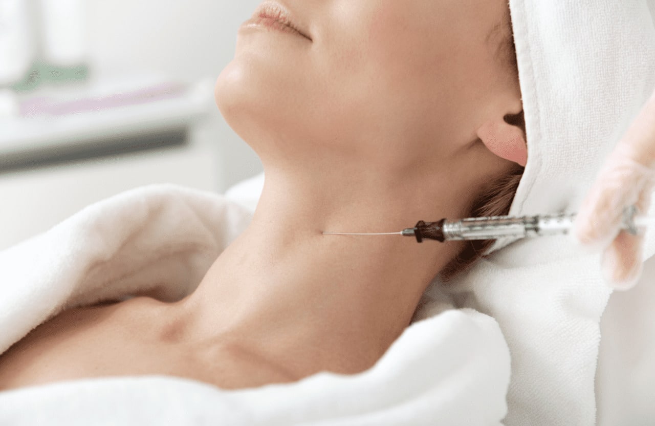 woman receiving a neck botox treatment