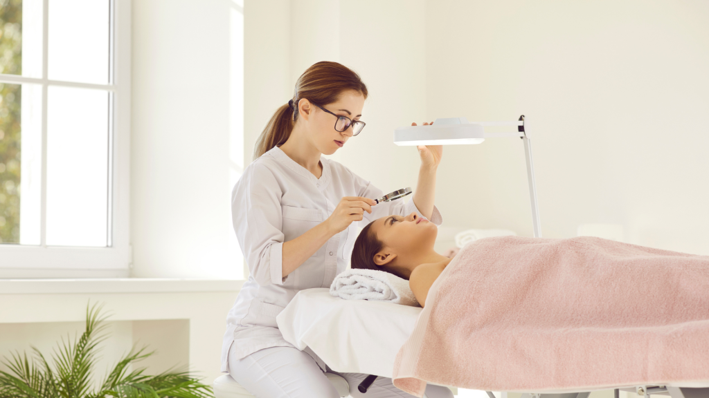 A skin specialist assesses the patient’s skin health and condition before treatment.