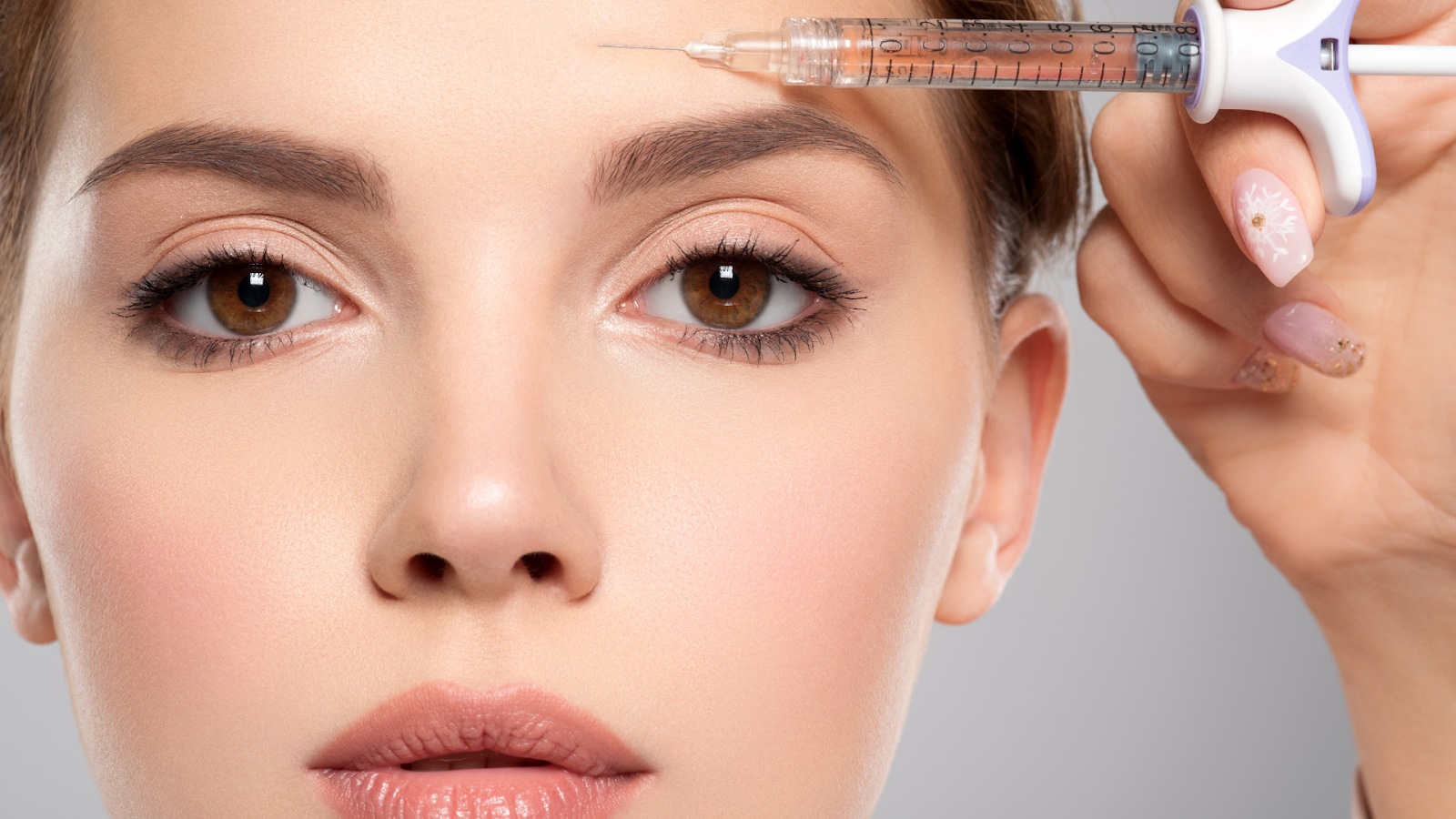 A medical professional injecting Botox into the forehead area of a patient.