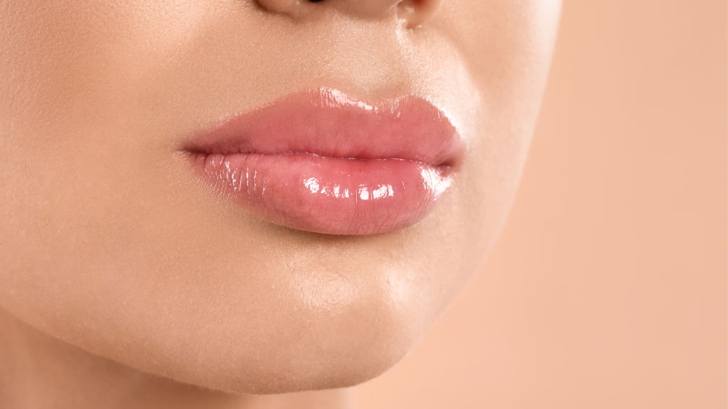 An individual flexing their full lips after Juvederm