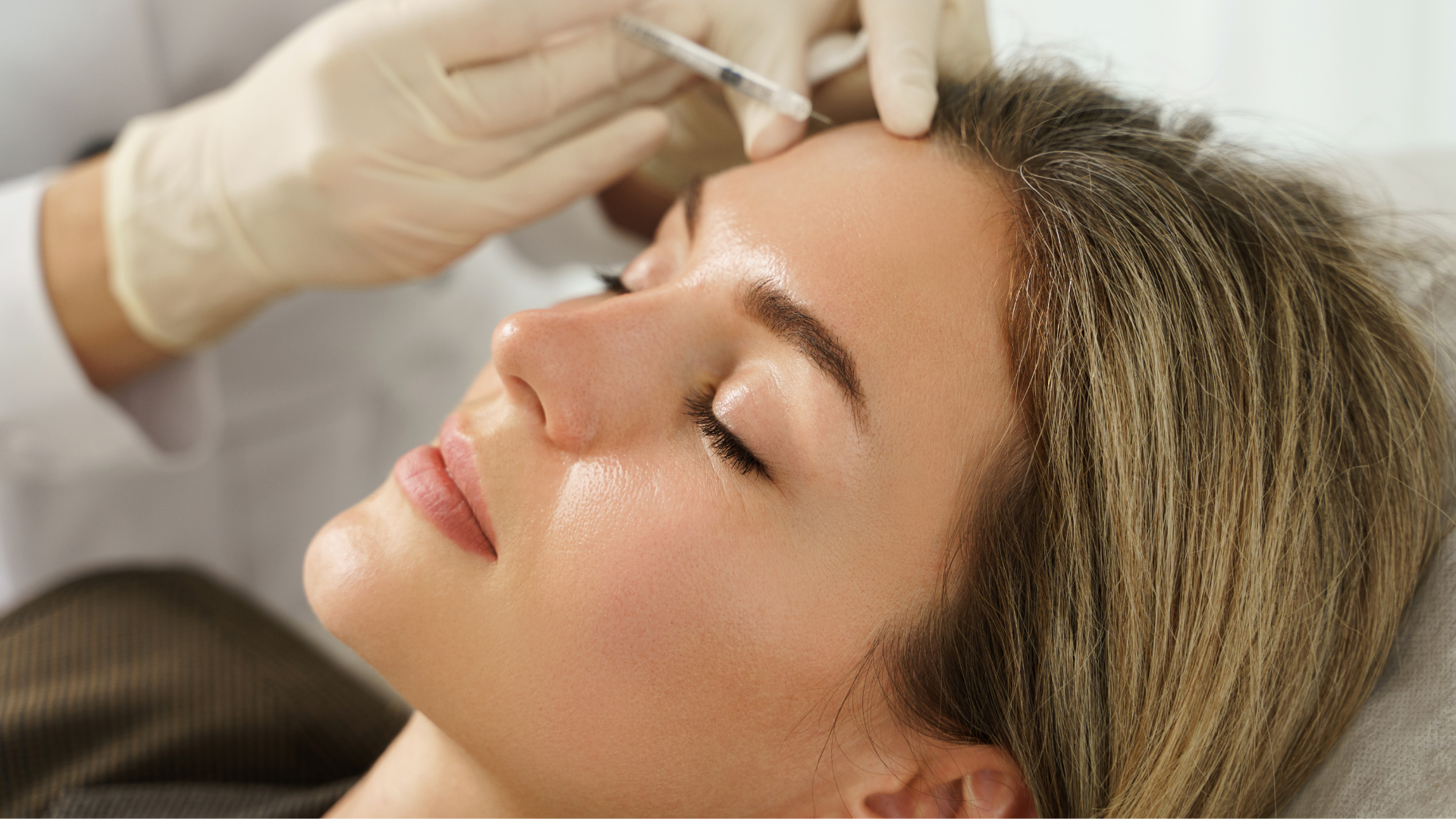 A patient getting an Juvederm fillers to improve appearance on their forehead.