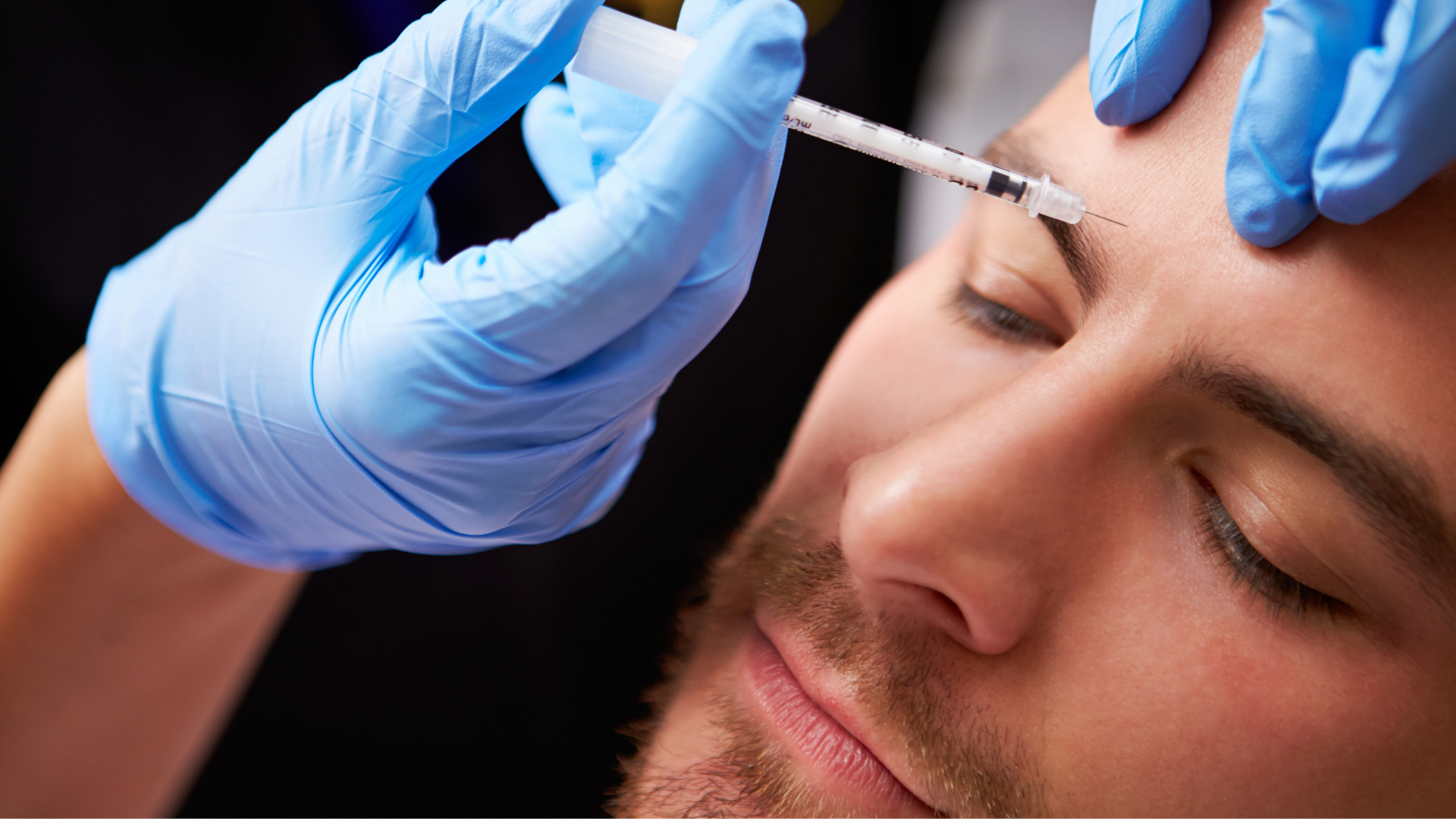 An individual receiving a Botox injection on his forehead.