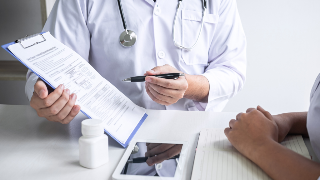 A medical practitioner explaining the treatment to their patient.