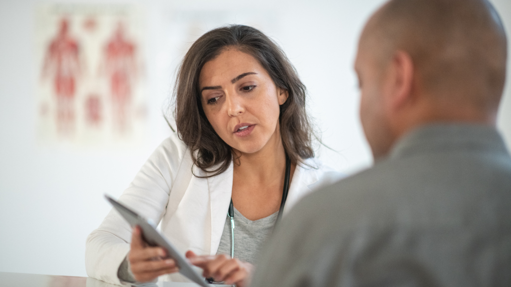 A healthcare provider discussing a treatment with a patient.