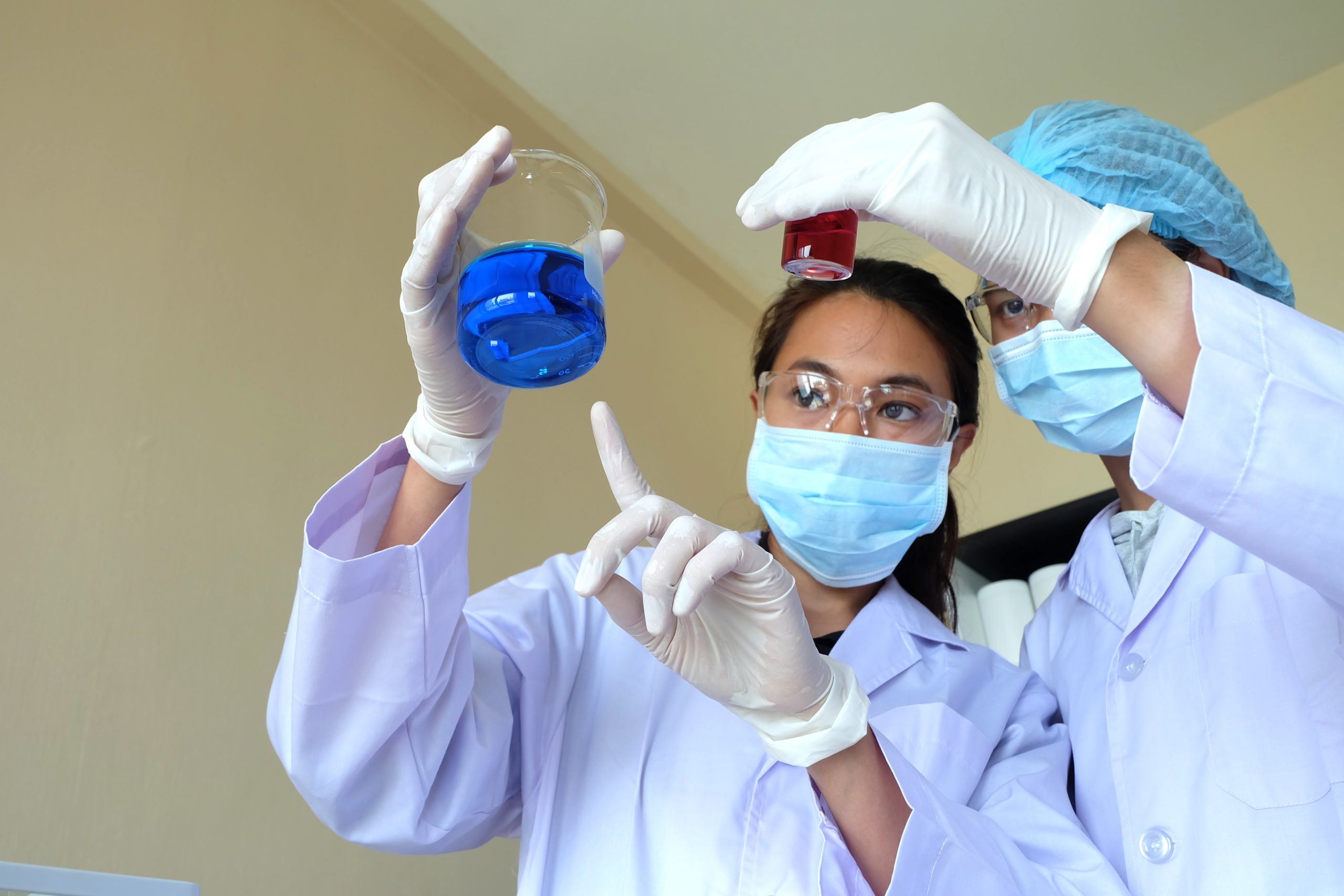 Medica researchers examining the formulations.