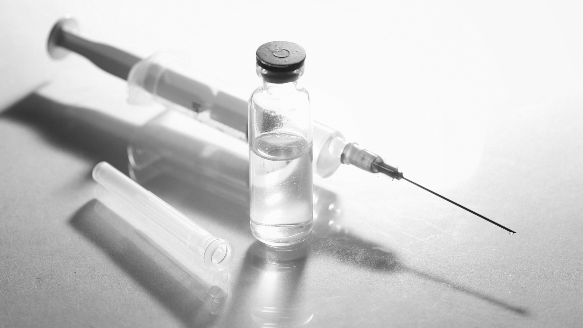 A syringe and a vial for injection.