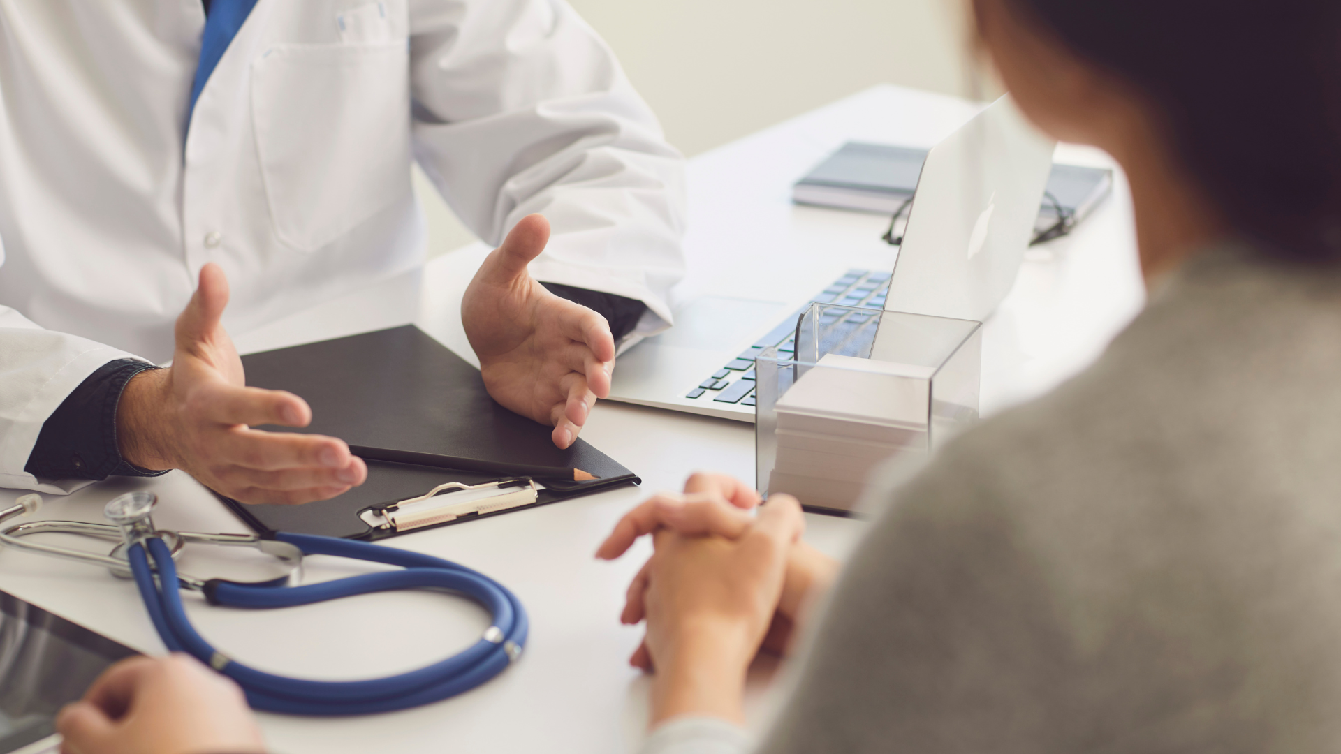 A medical practitioner explaining the treatment to their patient..