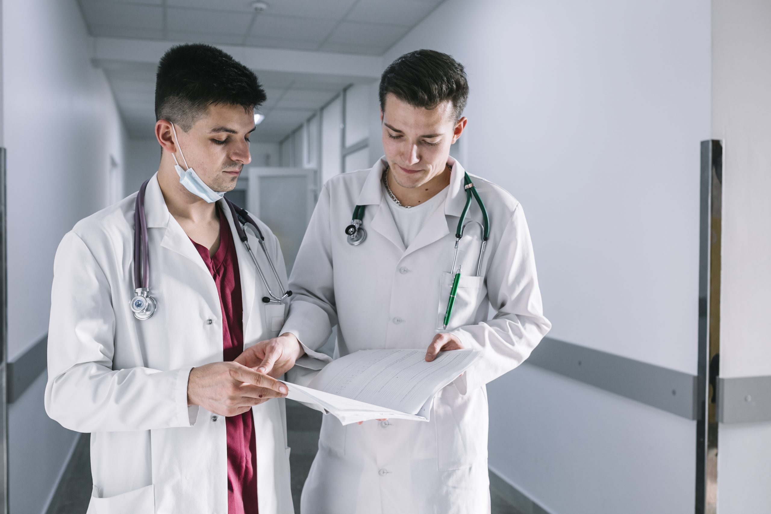 Medical professionals discussing about a patient's treatment.