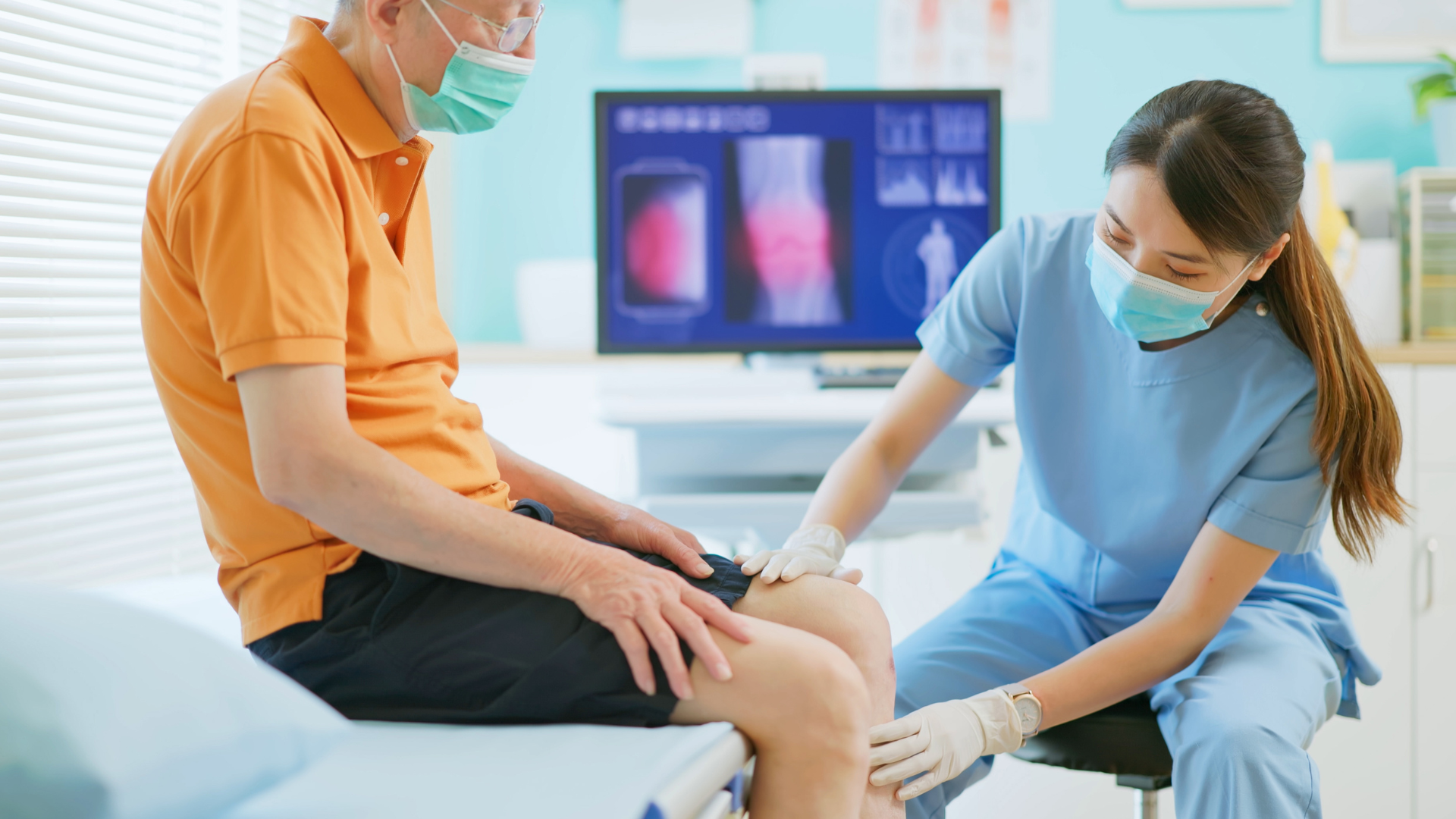 A healthcare provider examining the patient's knee.