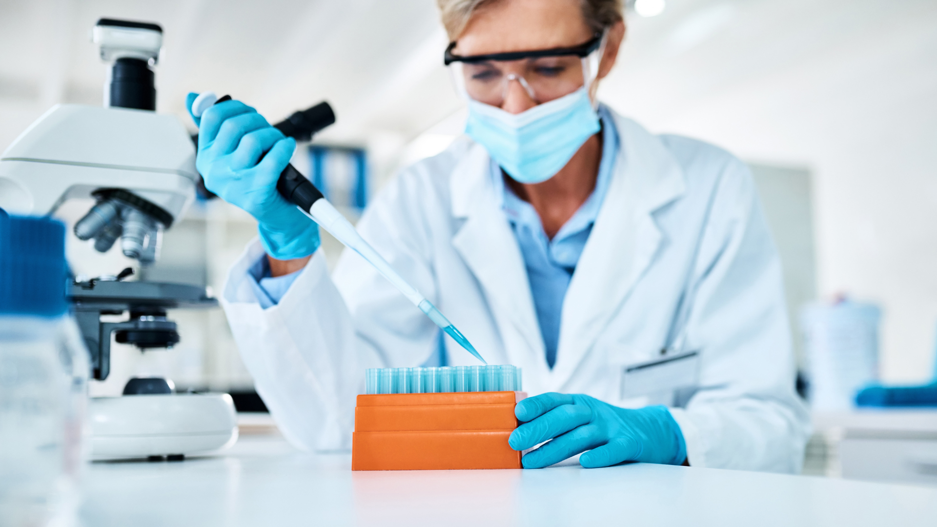 A medical expert filling the vials with the solution.