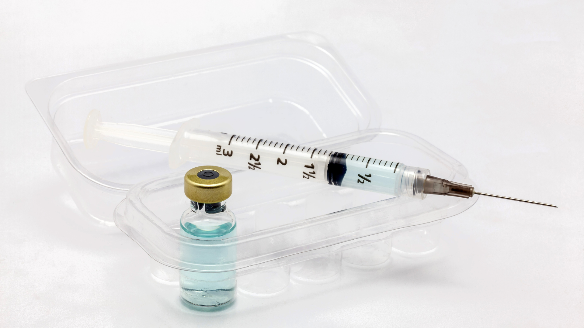 A syringe and vial used for medical treatments.