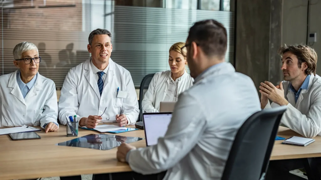 Medical professionals discussing about a treatment.