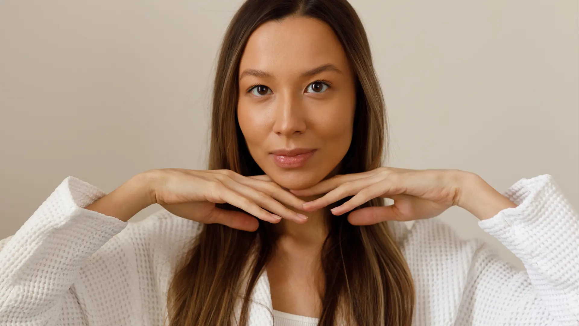 An individual flexing their smooth and flawless face.