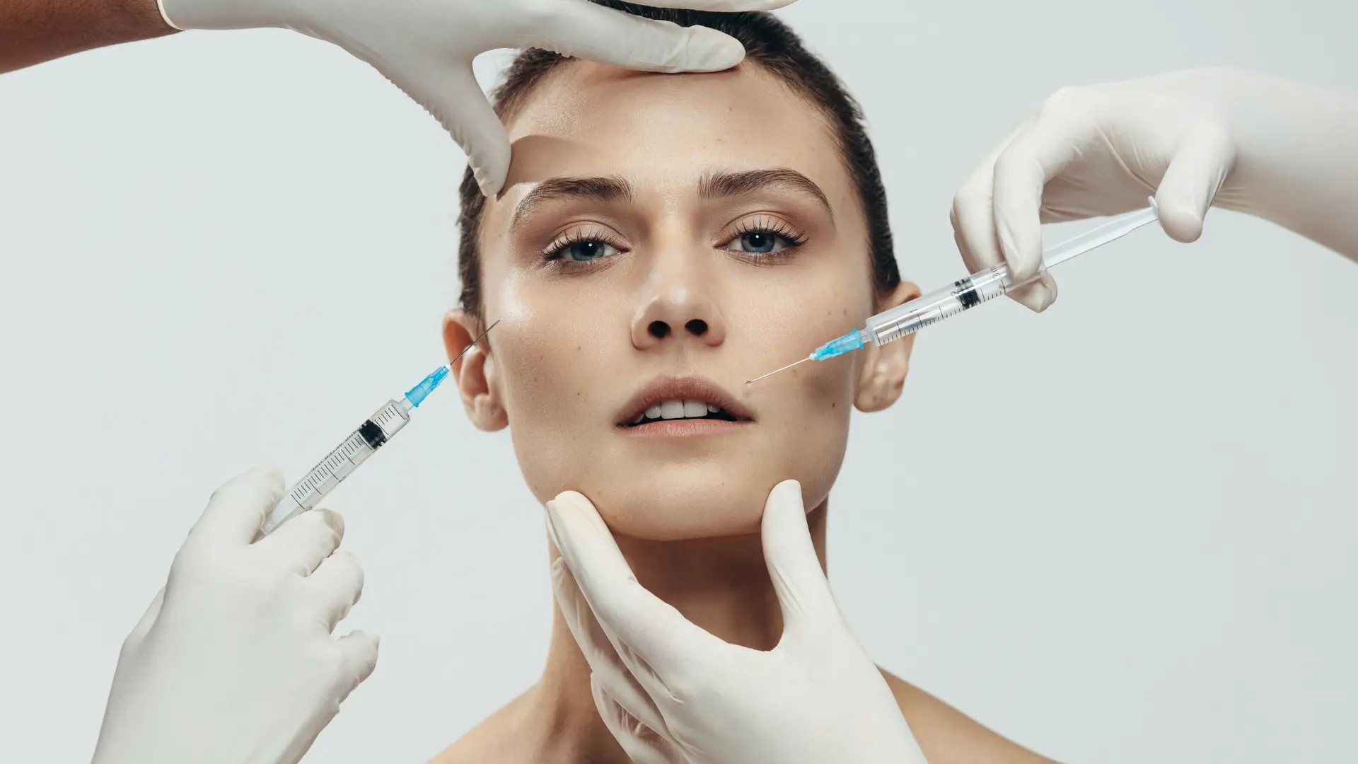 A patient receiving various injectable filler for their facial rejuvenation.