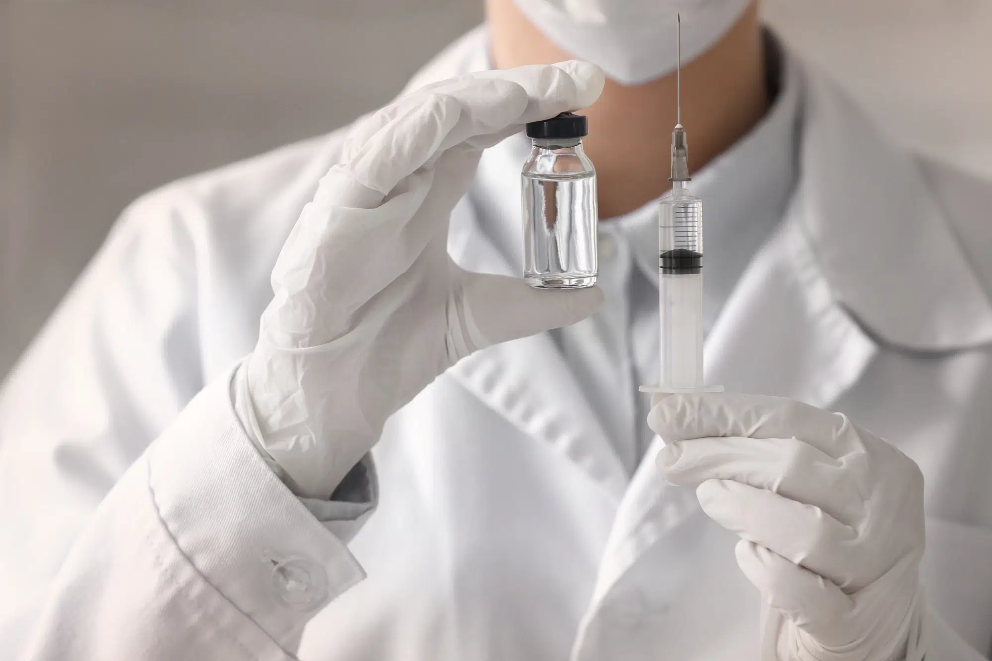 close up on medical professional holding syringe