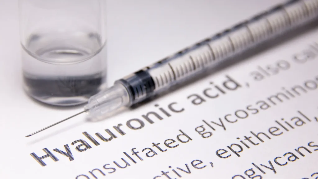 The list of hyaluronic acid properties with a medical syringe and vial on the side.