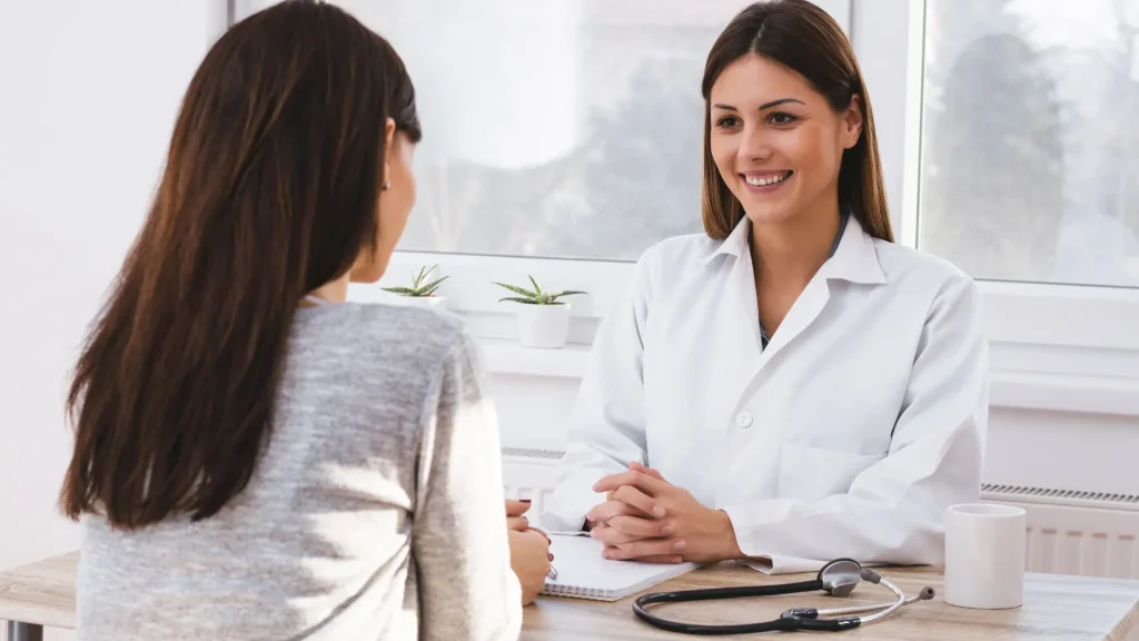 A doctor and patient consultation about the treatment.