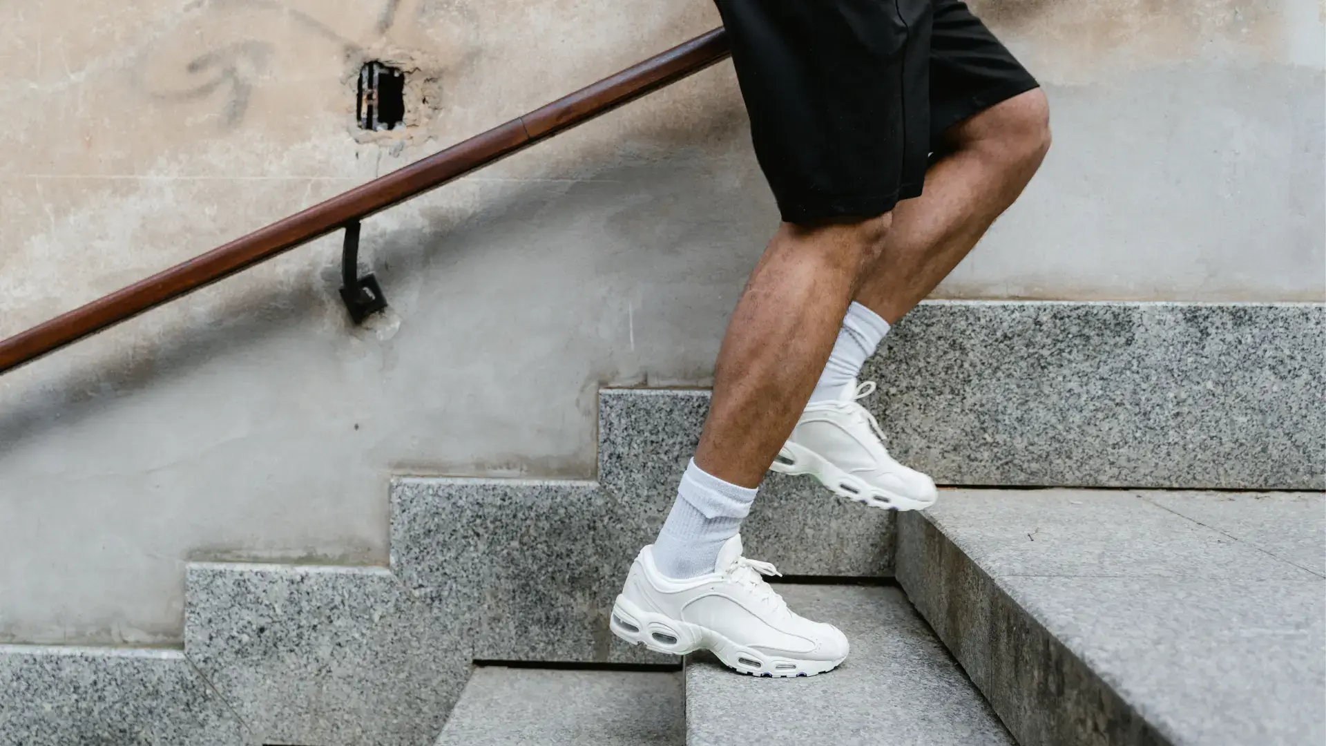 An individual climbing the stairs.