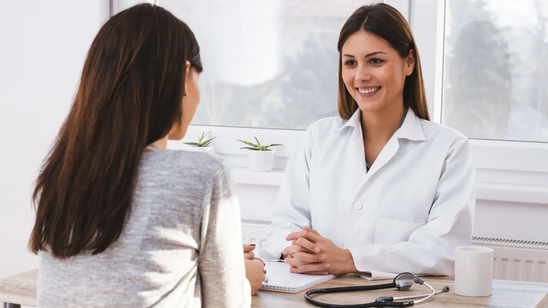 A medical professional and patients discussing a treatment.