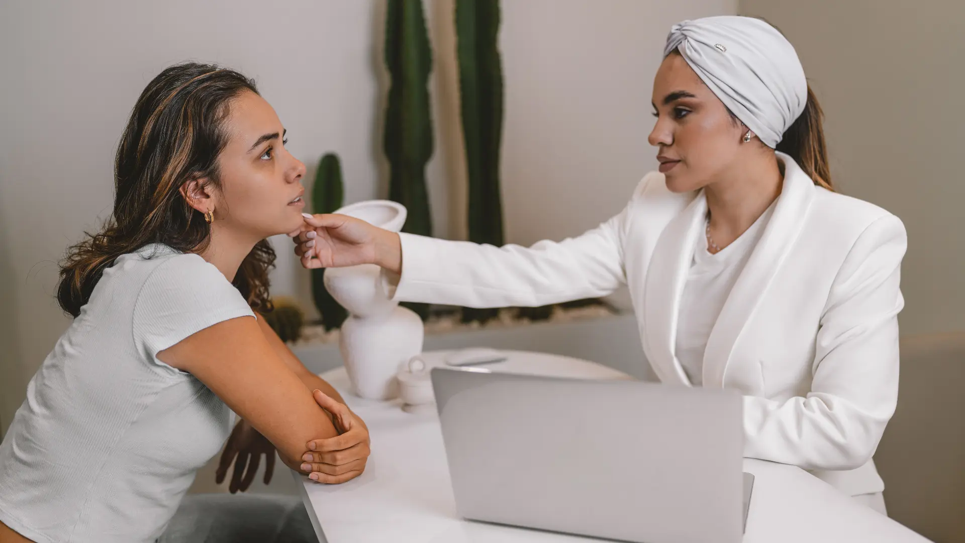 A healthcare provider assessing the patient's face.