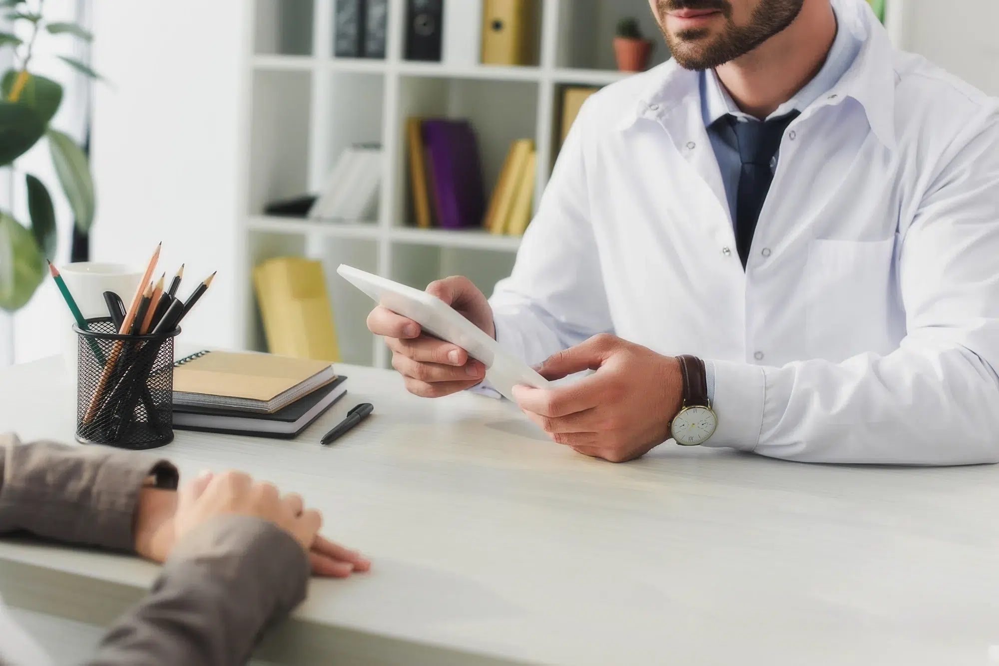 medical professional looking at the tablet