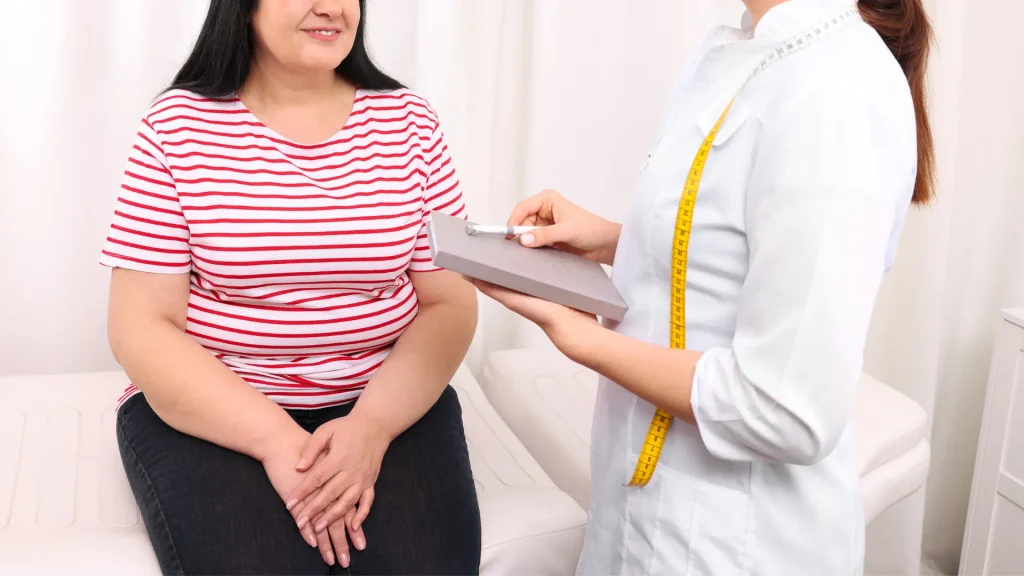 An individual consulting a healthcare provider about weight management.