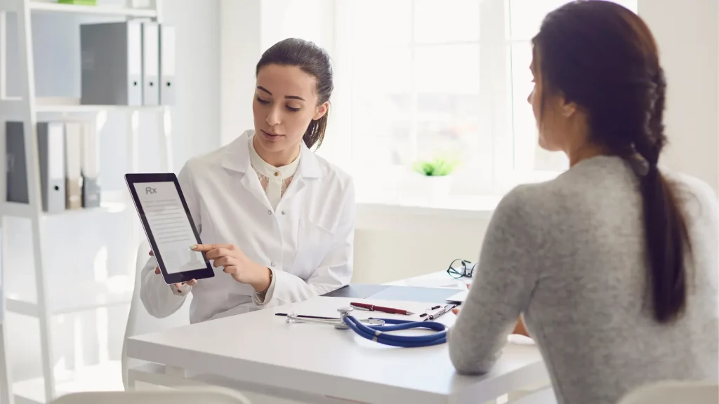 A patient consulting a medical practitioner about potential treatments.