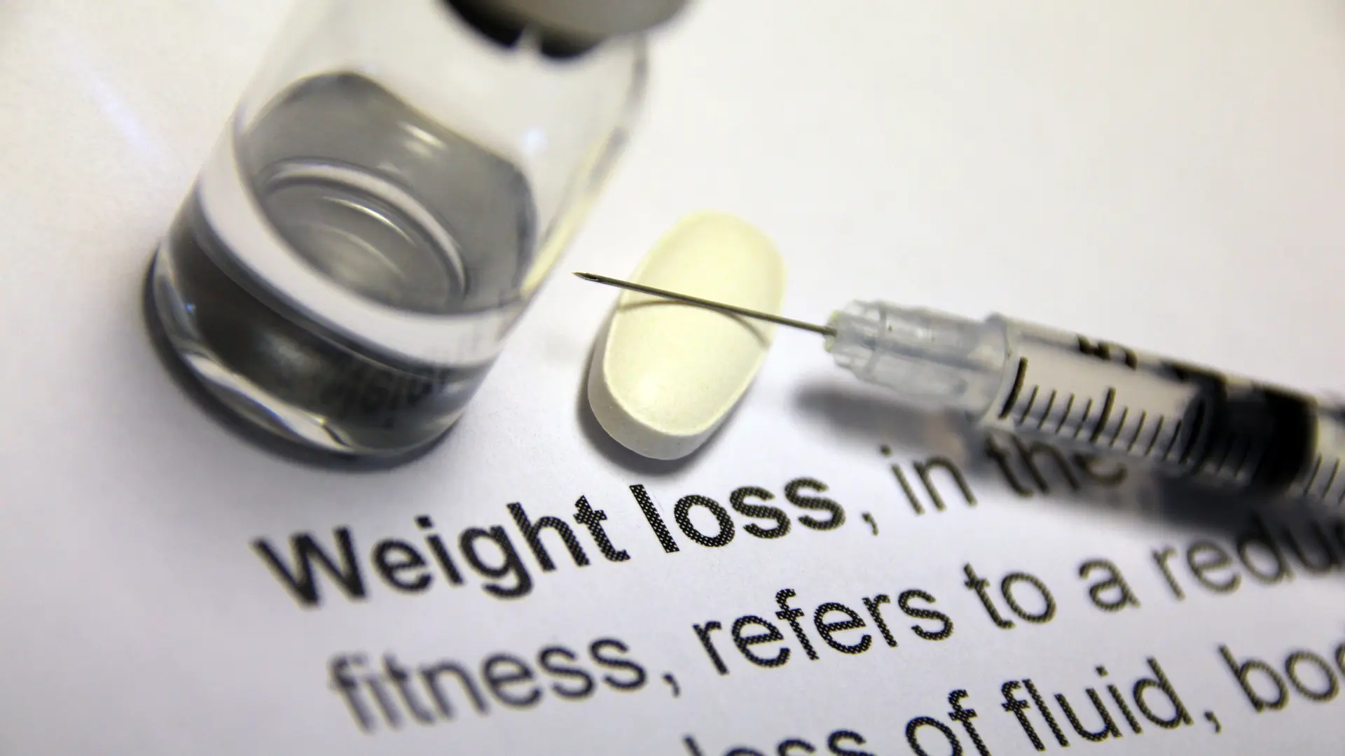 A close-up shot of the word weight loss and its definition.