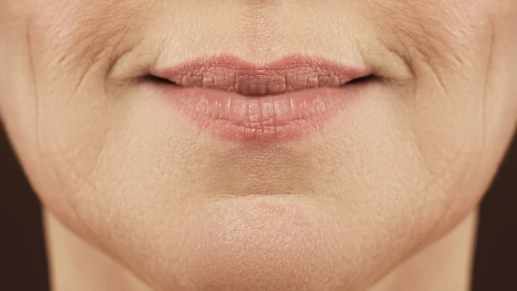 A close-up shot of a person's lower face region.